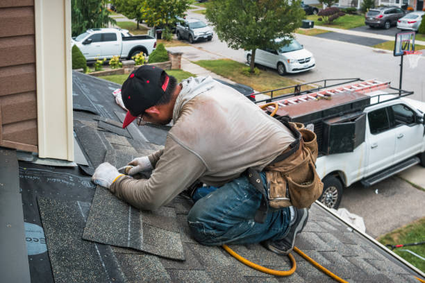 Professional Roofing technician working in Manville, RI